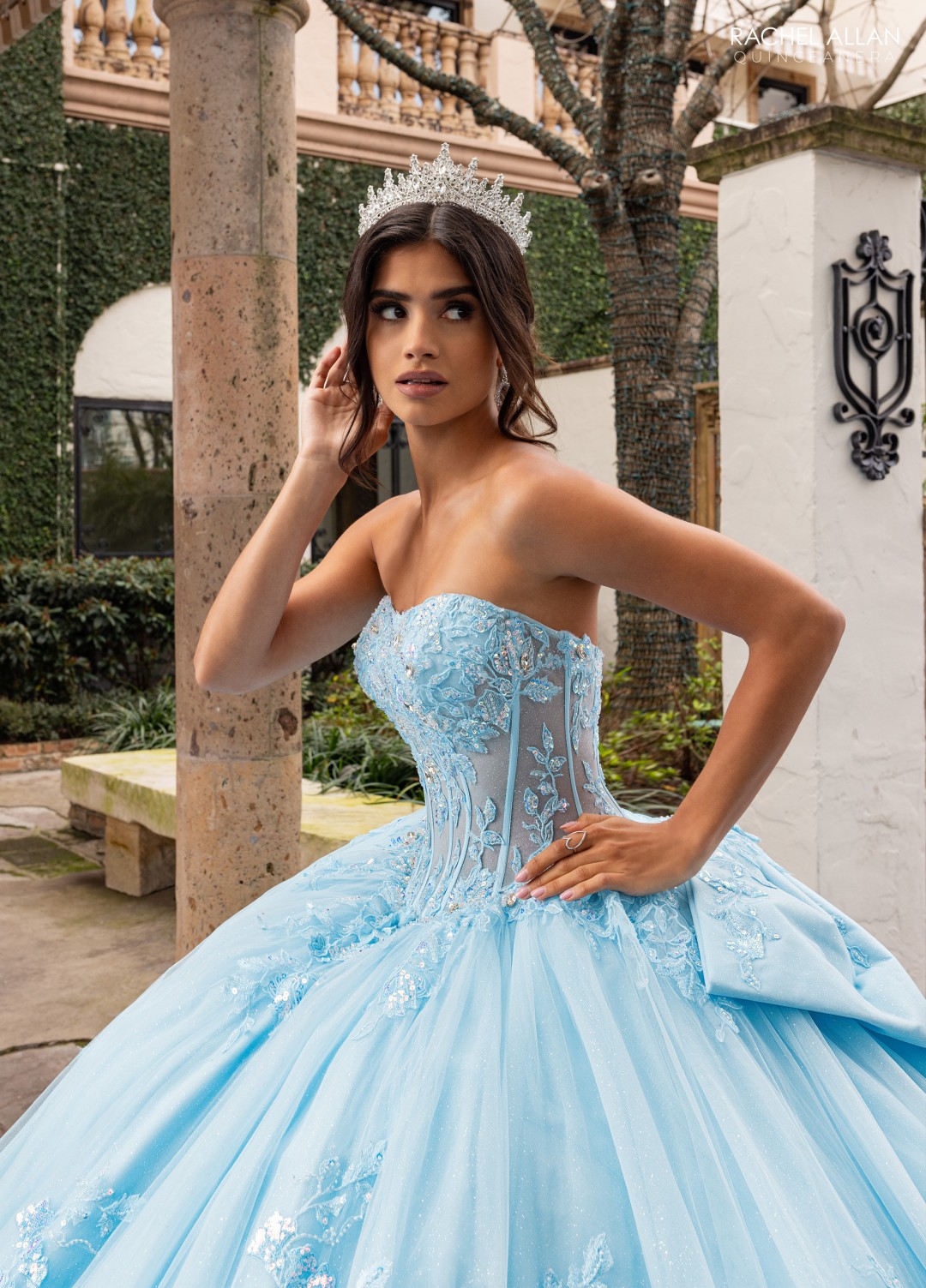 Blue Carmina Quinceañera gown with floral bodice and shimmer tulle skirt